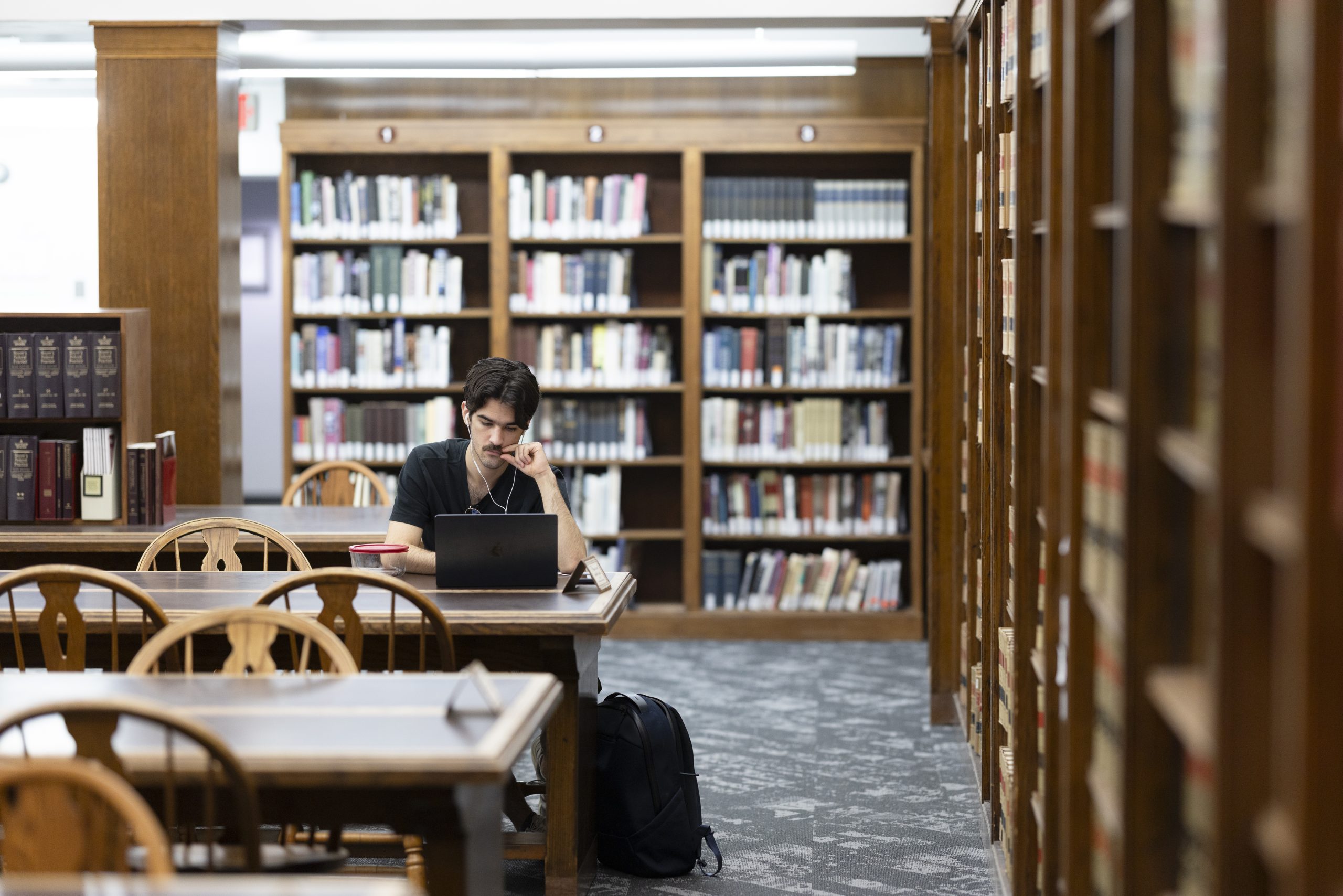 Student studying in the Quarles and Brady Room of the UW Law Library